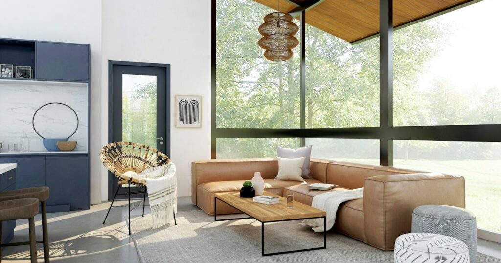 How to Maximize Natural Light in Dim Rooms: 9 Practical Interior Design Strategies living room with brown sofa and glass window