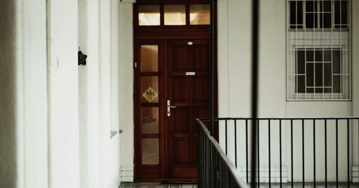Modern apartment interior doorway and threshold hallway demonstrating perimeter air-tight door sealing