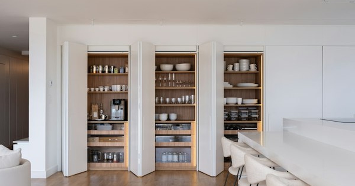 Two-tier pull-out sliding metal drawer organizer installed inside under-sink cabinet