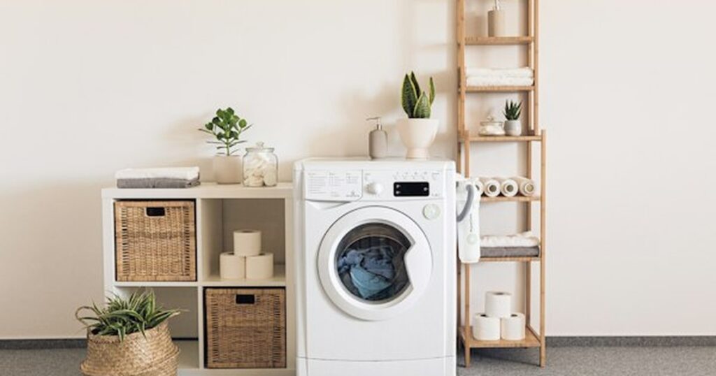 Non-Toxic Natural Laundry Care: Soap Nuts, Wool Dryer Balls, and Vinegar Rinsing Protocols Eco-friendly natural laundry room with washing machine, neutral folded towels, and woven baskets
